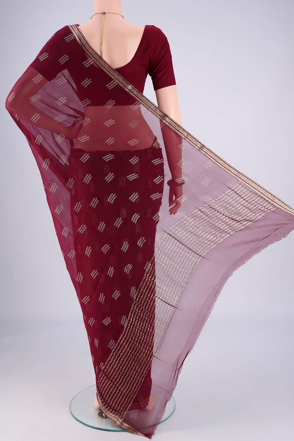 Flat view of Burgundy Mysore Chiffon Saree with Zari Butta on the body and Zari Border. 