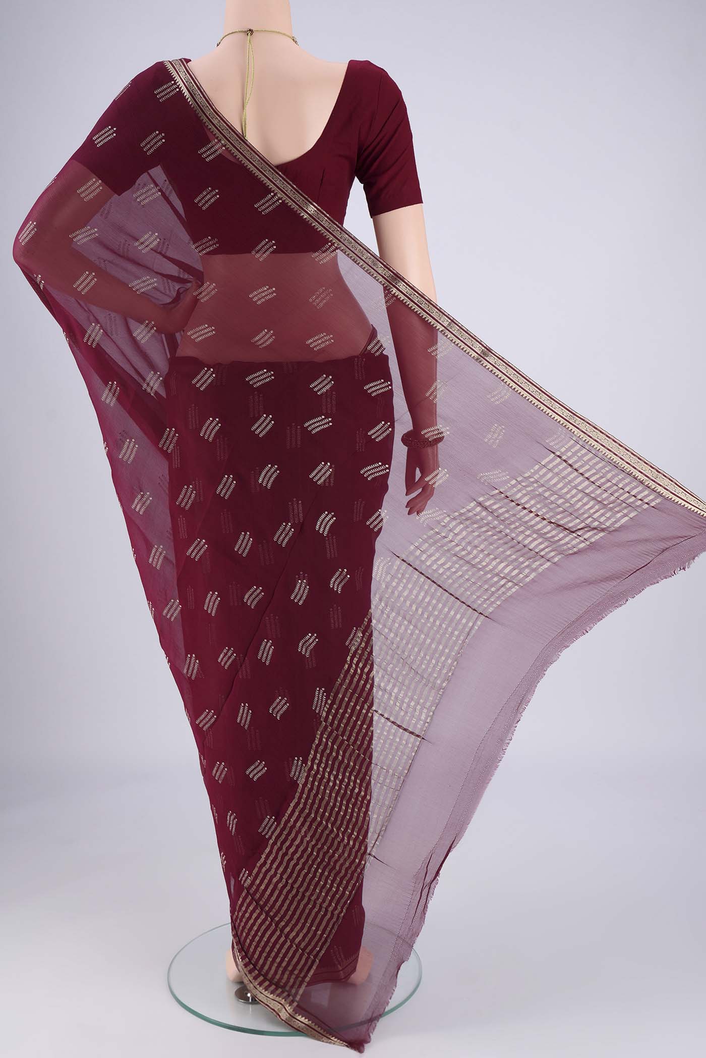 Flat view of Burgundy Mysore Chiffon Saree with Zari Butta on the body and Zari Border. 