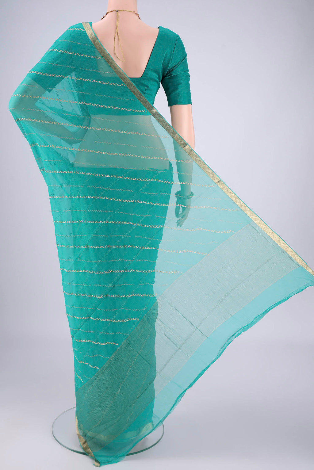 Flat view of Turquoise Mysore Chiffon Saree with Stripes on the body and Zari Border. 