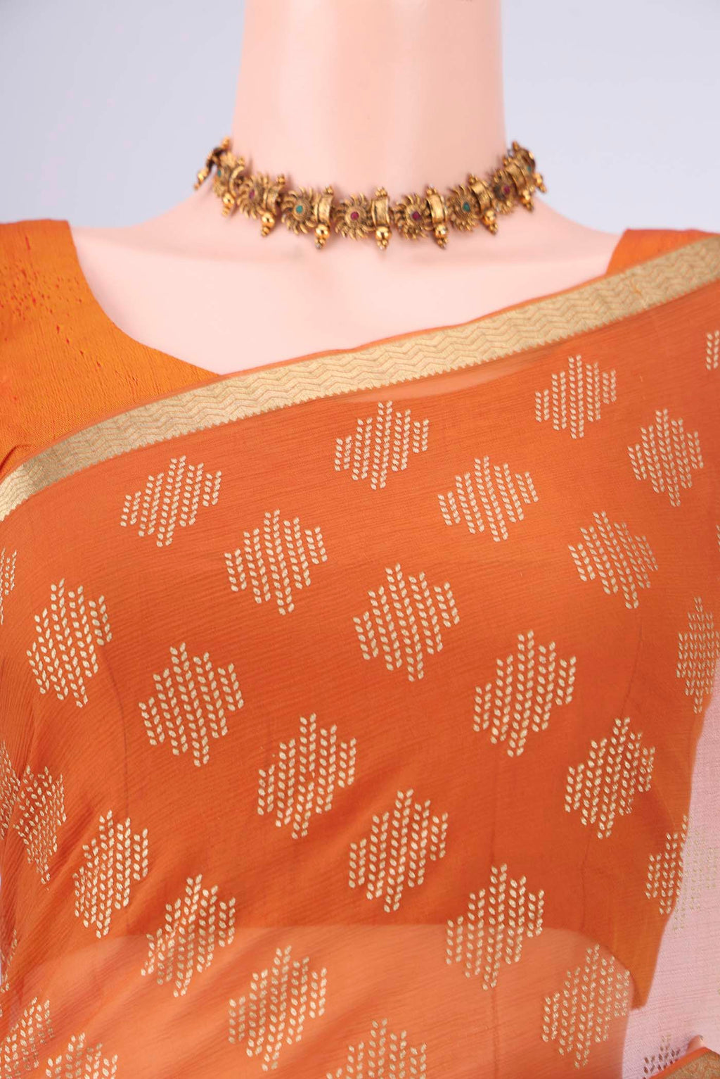 Border image of Brick Orange Mysore Chiffon Saree with Zari Butta on the body and Zari Border. 