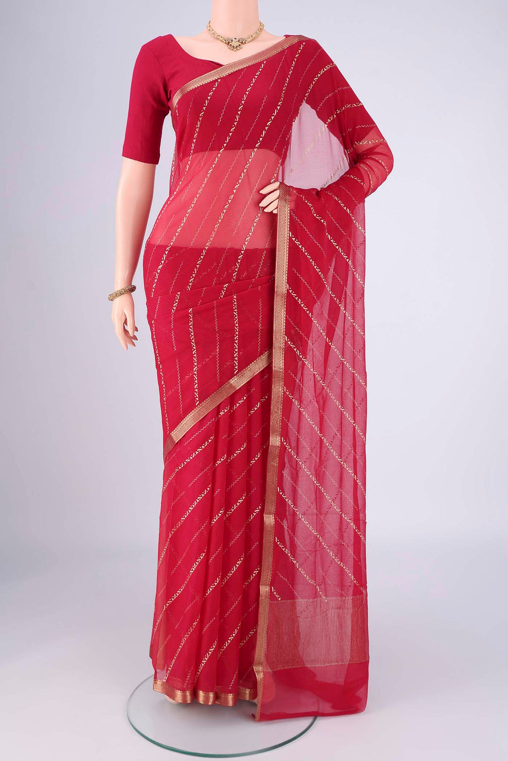 Dark Pink Mysore Chiffon Saree with Stripes on the body and Zari Border.  displayed on a mannequin