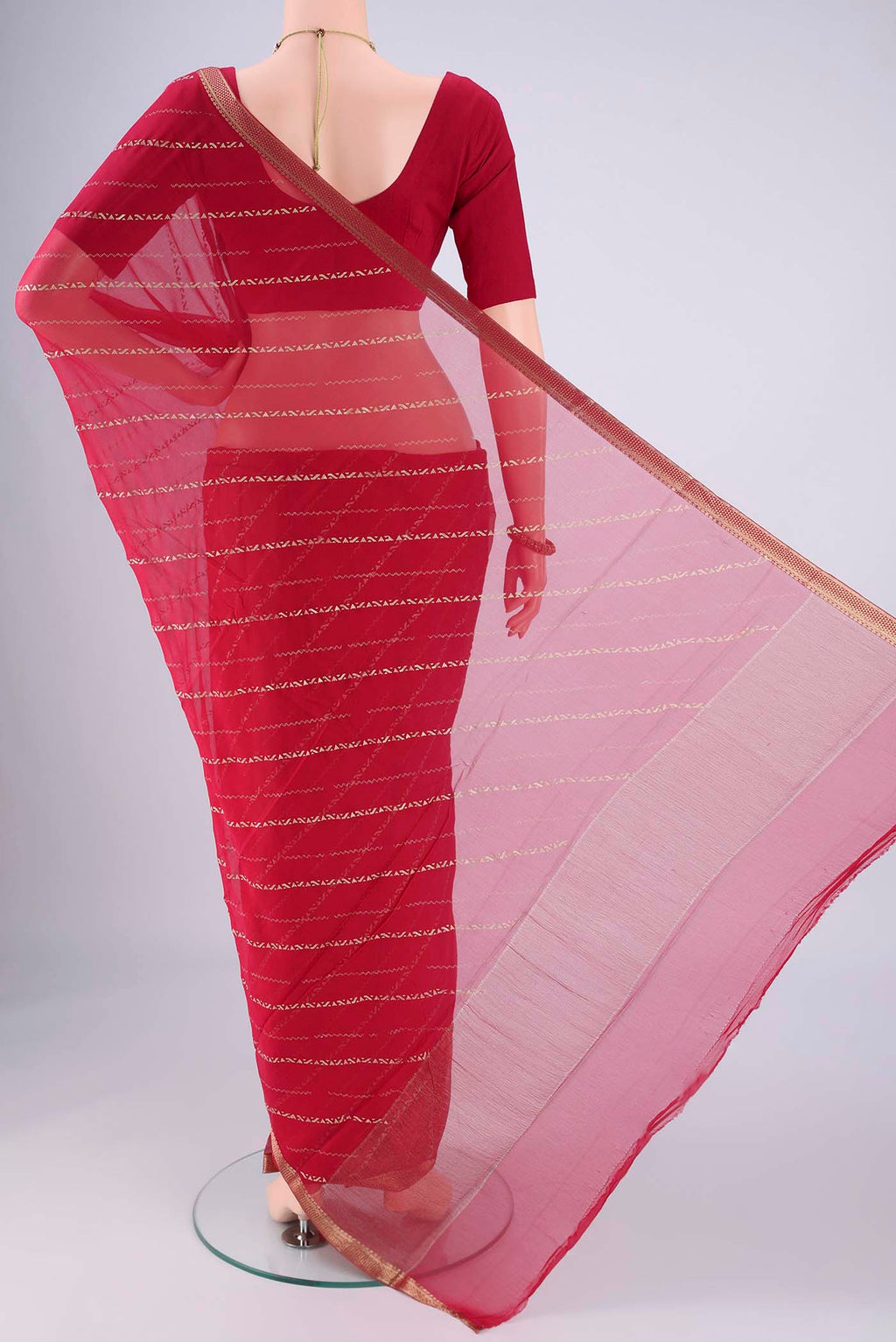Flat view of Dark Pink Mysore Chiffon Saree with Stripes on the body and Zari Border. 