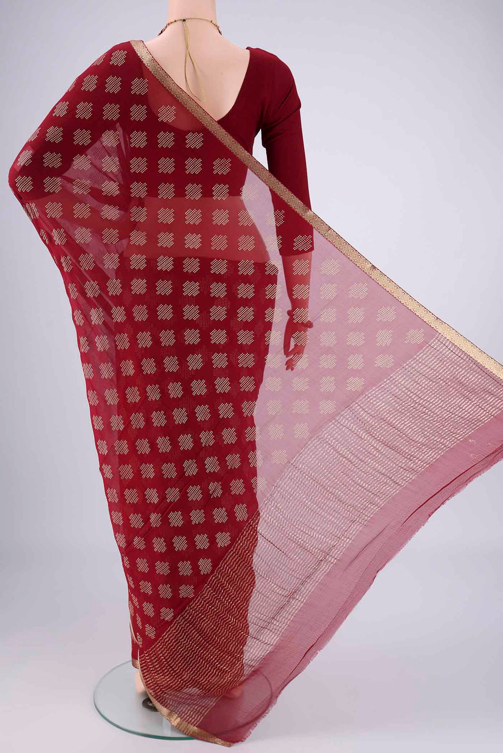 Flat view of Maroon Mysore Chiffon Saree with Zari Butta on the body and Zari Border. 