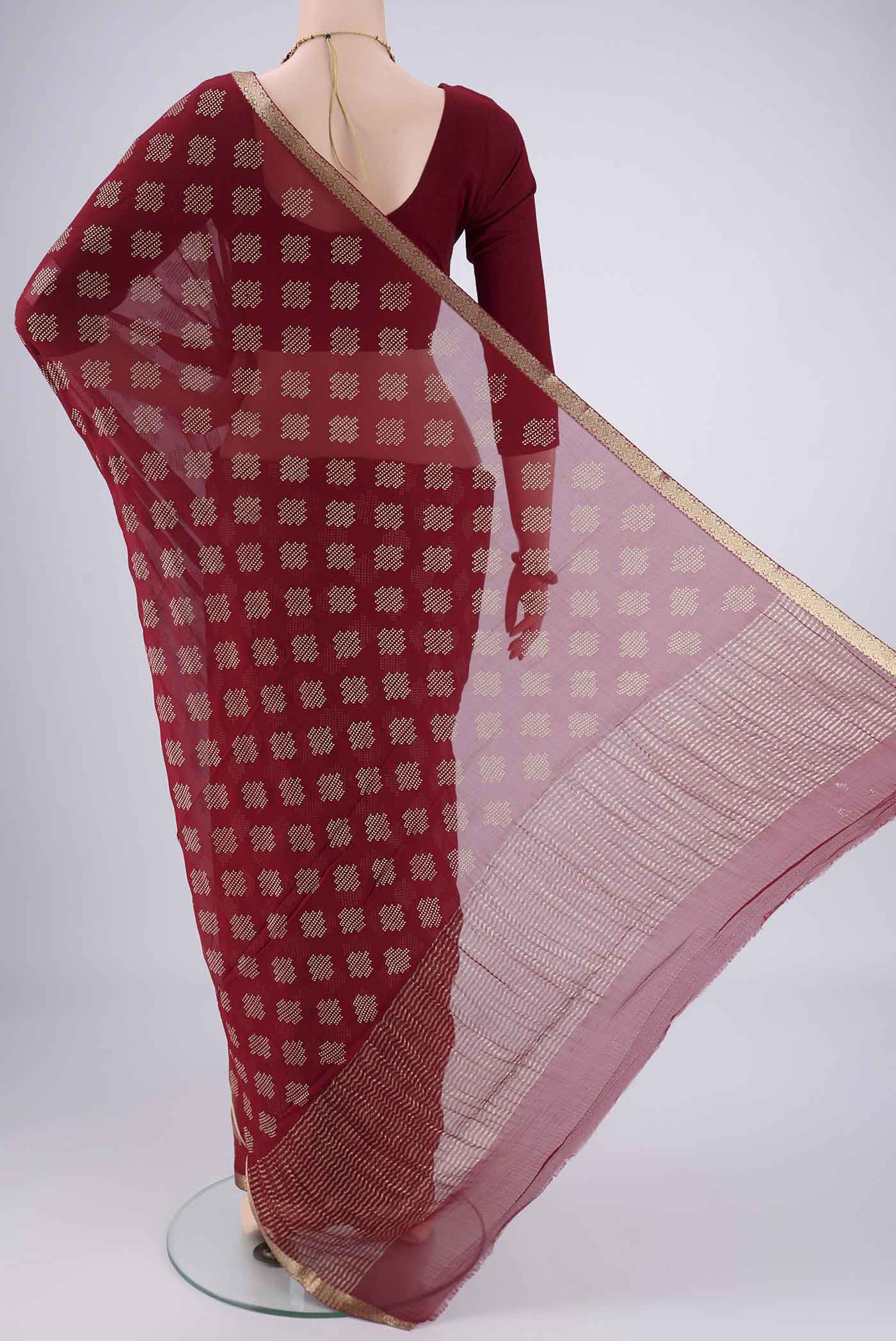 Flat view of Maroon Mysore Chiffon Saree with Zari Butta on the body and Zari Border. 