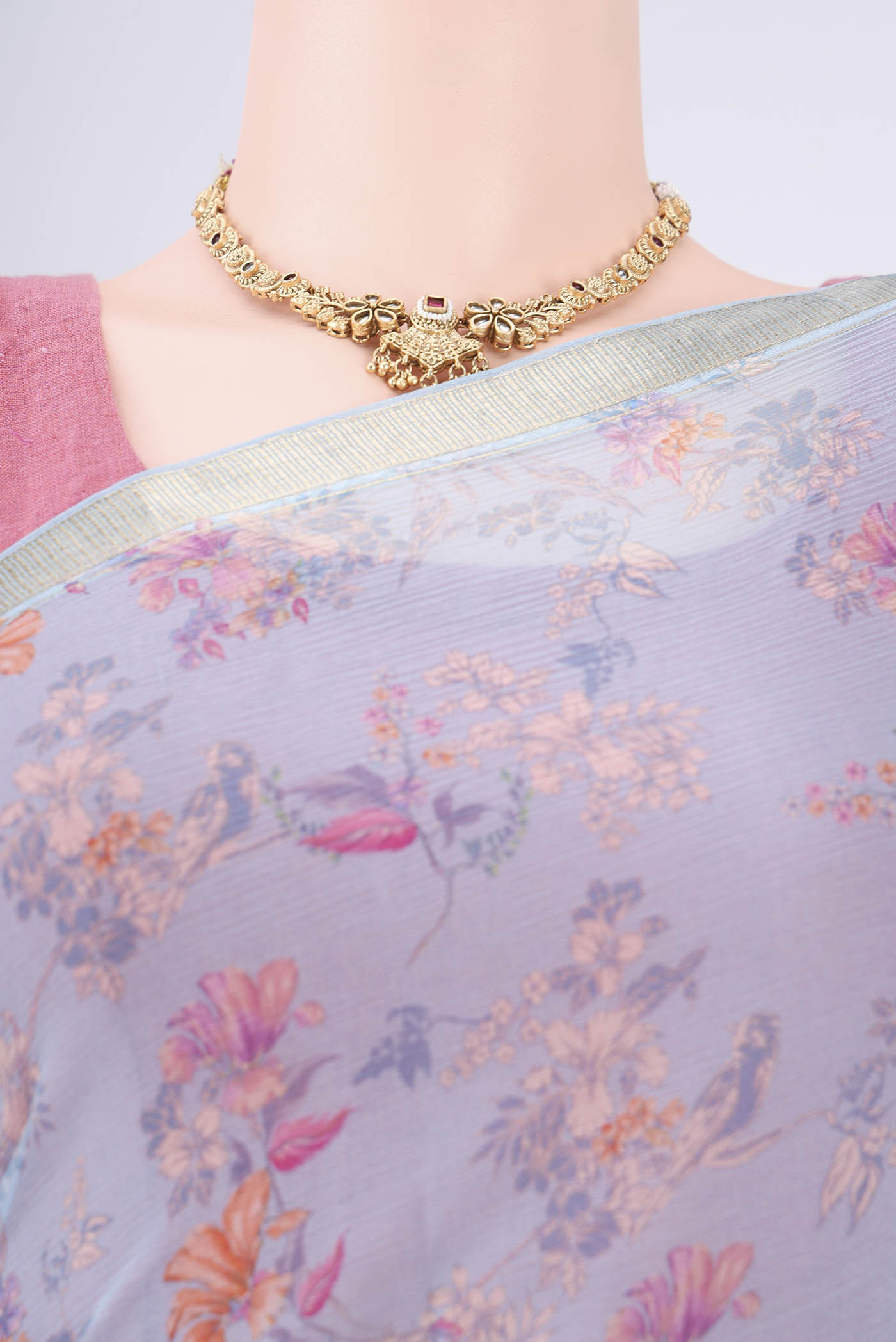Border image of Sky Blue Mysore Crepe Saree with Printed design on the body and Zari Border. 