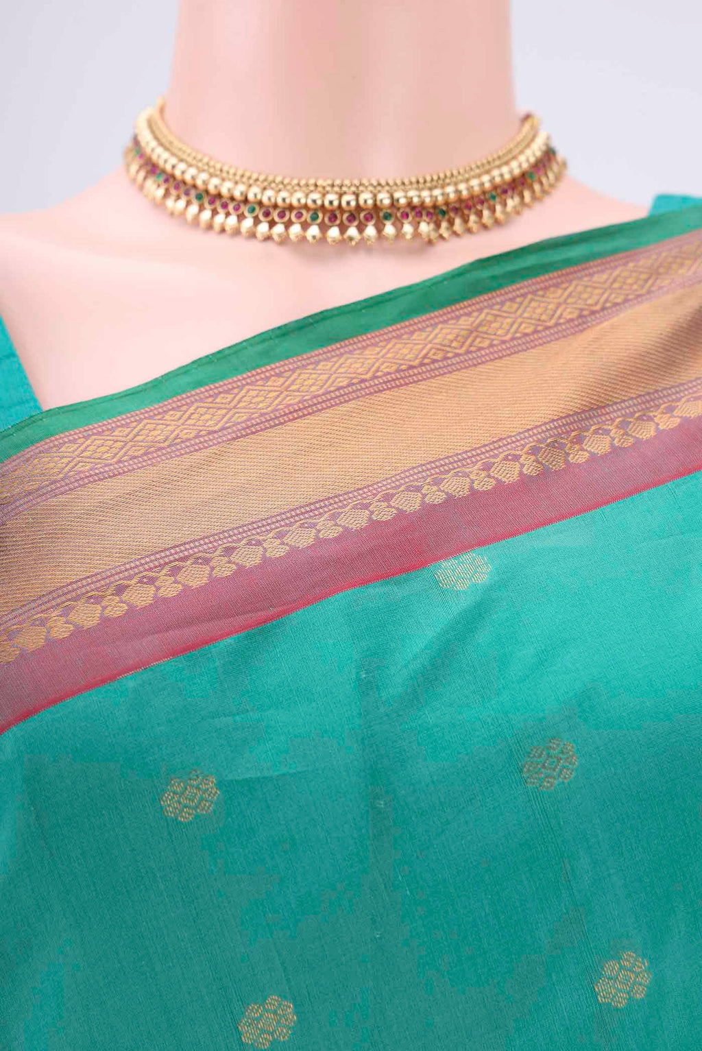 Border image of Sea Green Gadwal Silk Saree with Zari Butta on the body and Zari Border. 