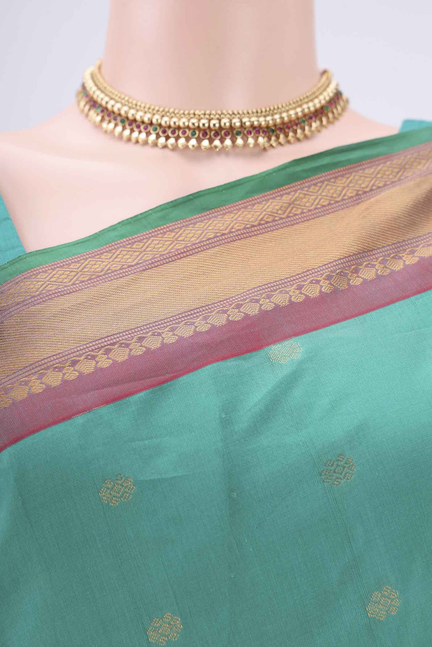 Border image of Sea Green Gadwal Silk Saree with Zari Butta on the body and Zari Border. 