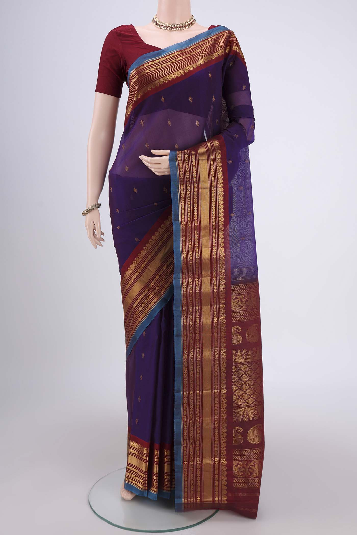 Purple Gadwal Silk Saree with Zari Butta on the body and Zari Border.  displayed on a mannequin