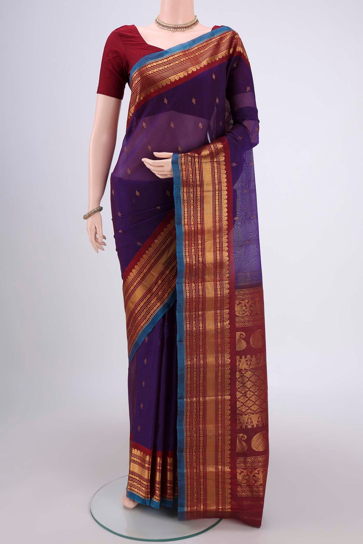 Purple Gadwal Silk Saree with Zari Butta on the body and Zari Border.  displayed on a mannequin