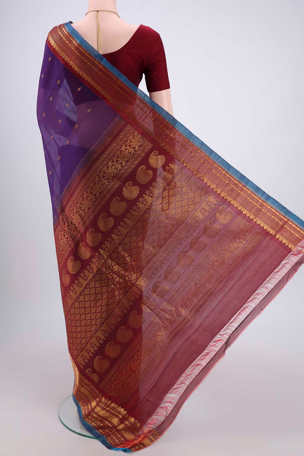Flat view of Purple Gadwal Silk Saree with Zari Butta on the body and Zari Border. 
