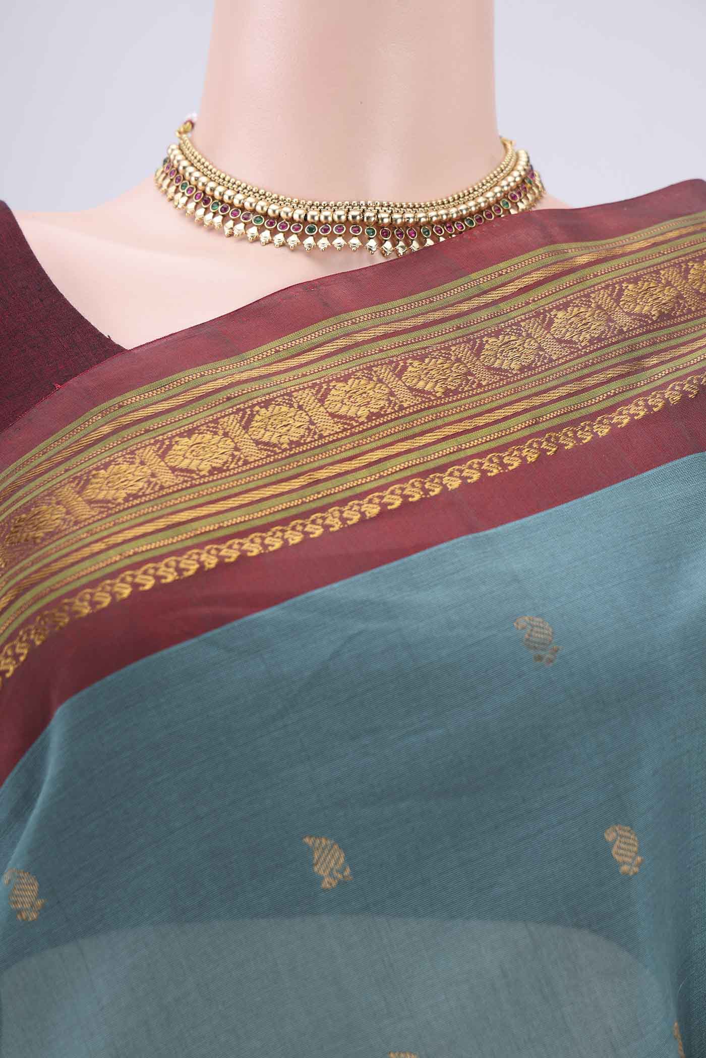 Border image of Maya Blue Gadwal Silk Saree with Zari Butta on the body and Zari Border. 