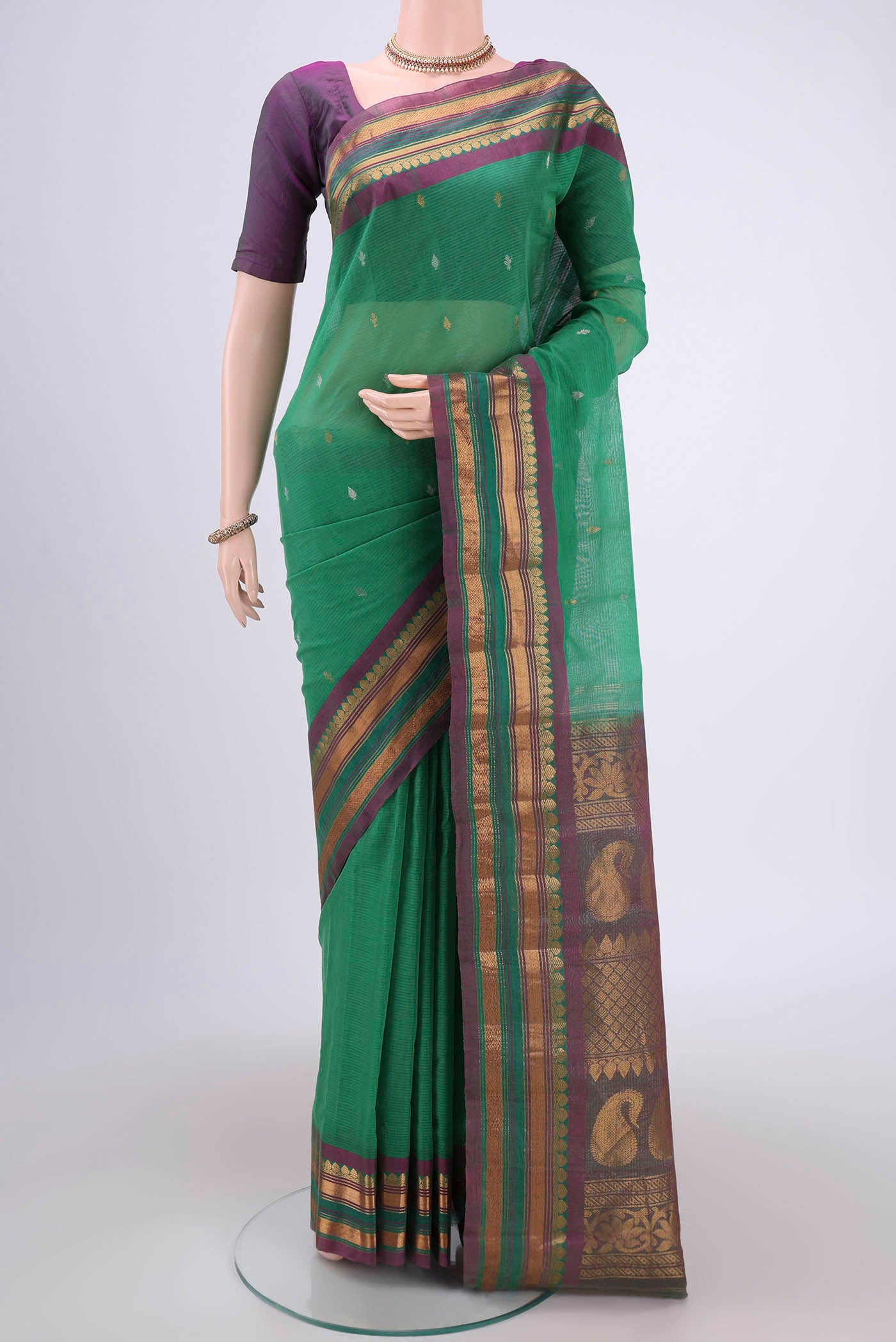 Green Gadwal Silk Saree with Stripes on the body and Zari Border.  displayed on a mannequin