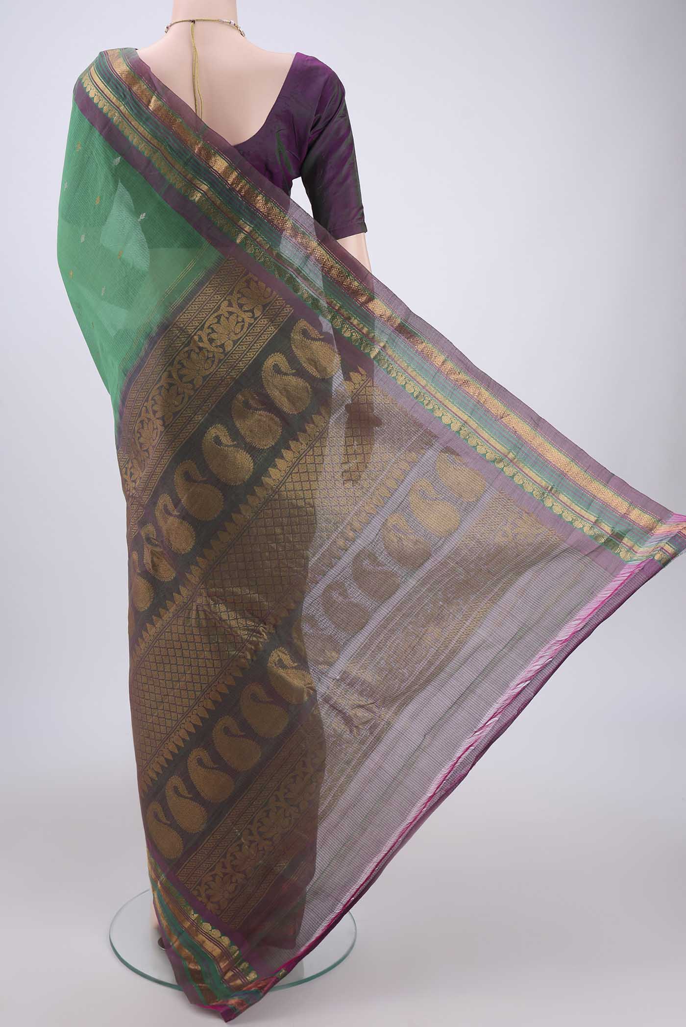 Flat view of Green Gadwal Silk Saree with Stripes on the body and Zari Border. 