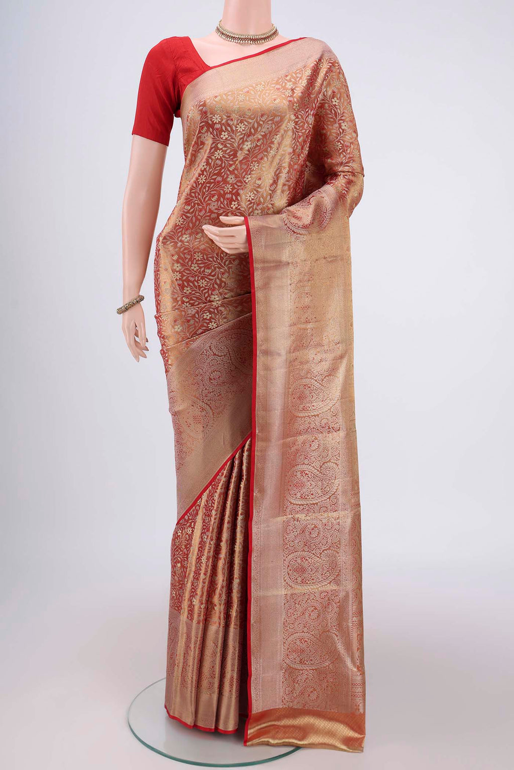 Red Kanjivaram Silk Saree with Zari Brocade on the body and Zari Border.  displayed on a mannequin