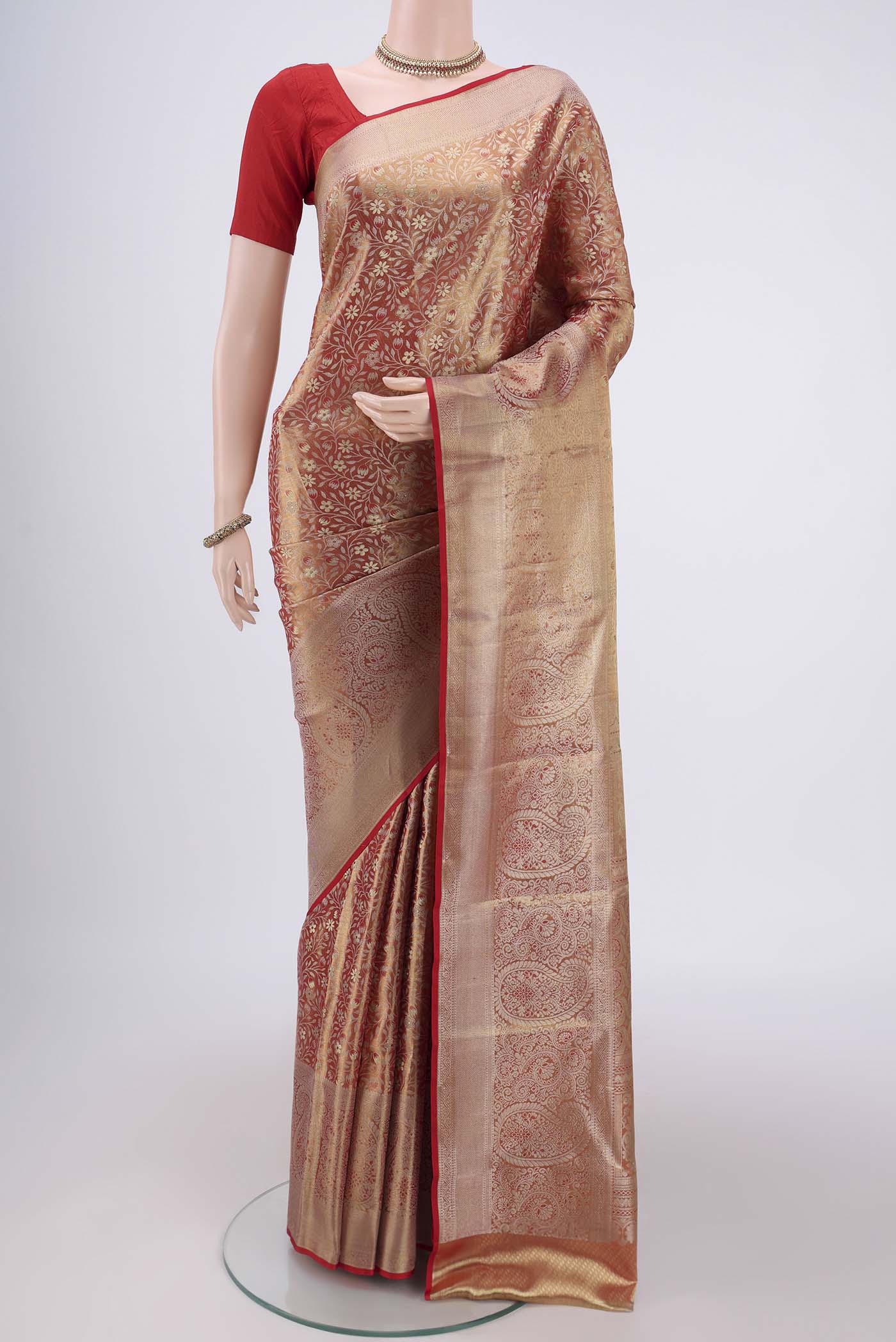 Red Kanjivaram Silk Saree with Zari Brocade on the body and Zari Border.  displayed on a mannequin