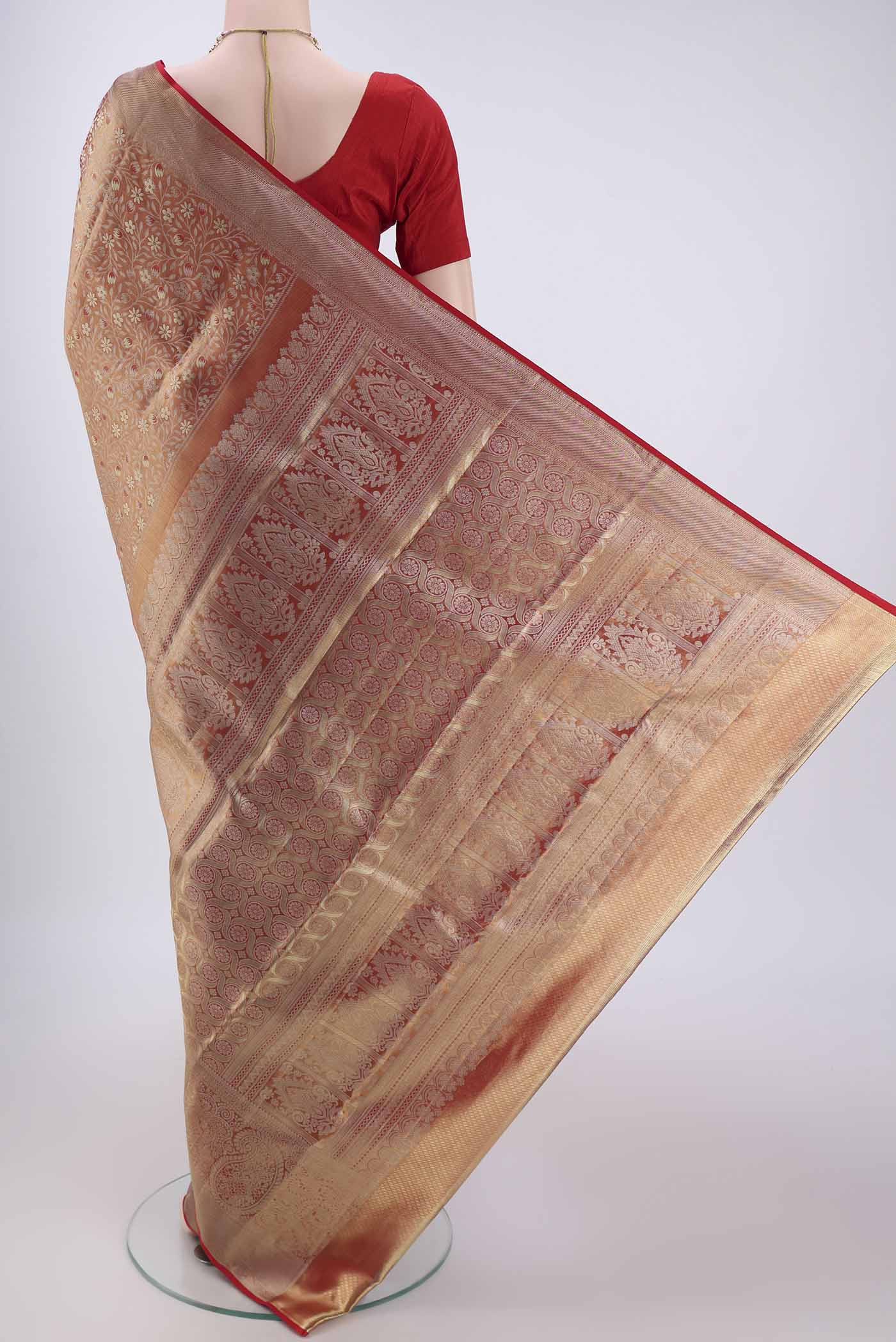 Flat view of Red Kanjivaram Silk Saree with Zari Brocade on the body and Zari Border. 