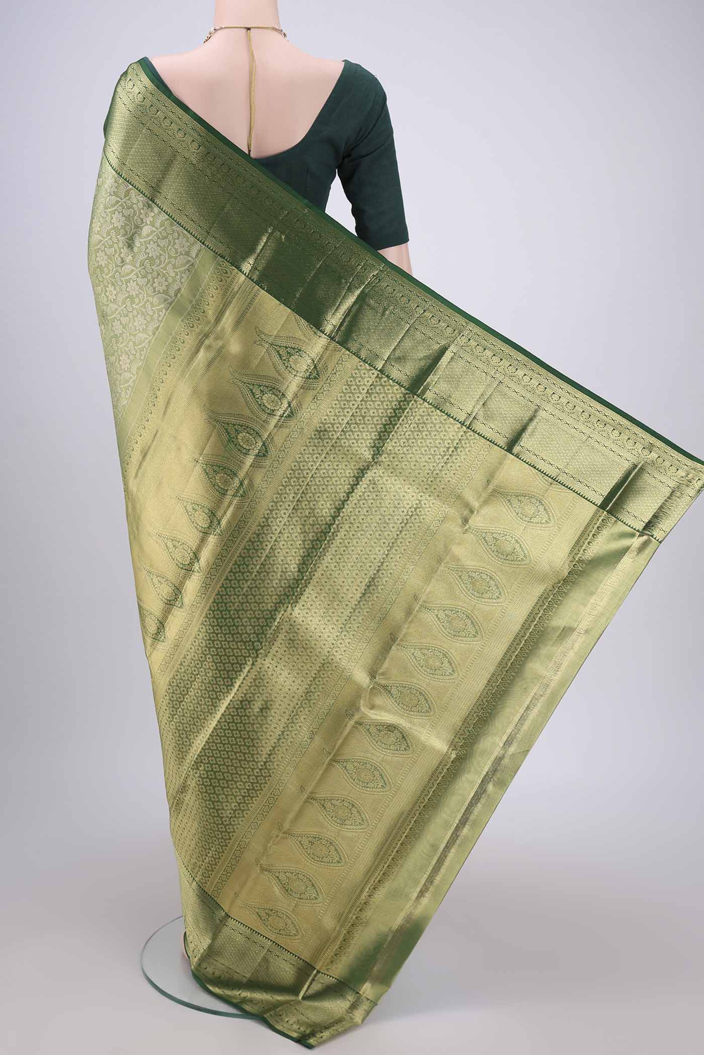 Flat view of Bottle Green Kanjivaram Silk Saree with Zari Brocade on the body and Zari Border. 
