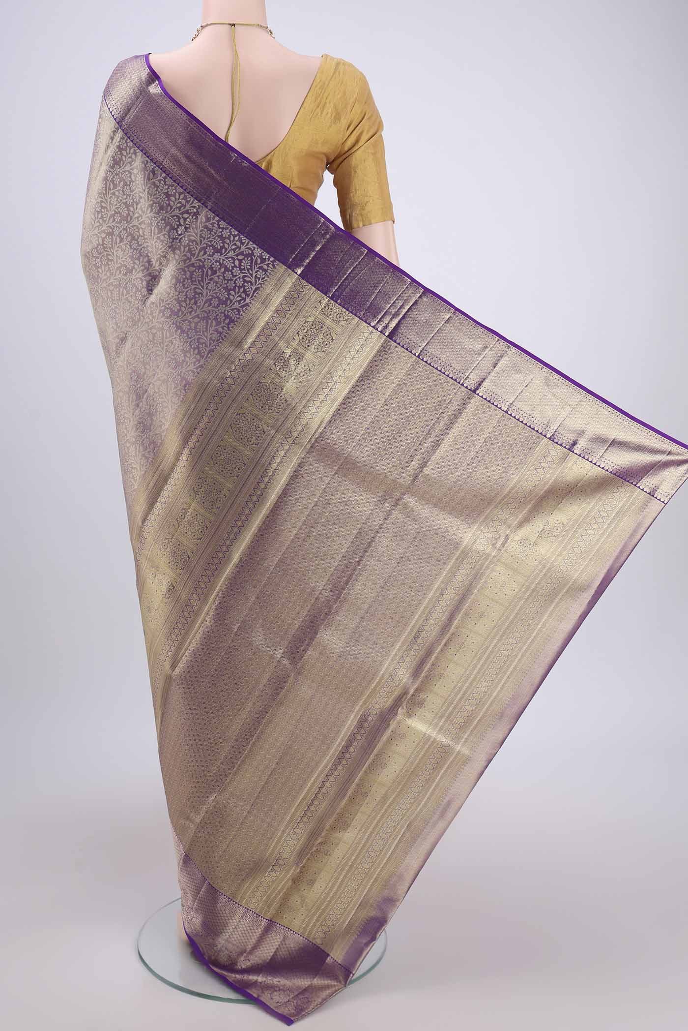 Flat view of Purple Kanjivaram Silk Saree with Zari Brocade on the body and Zari Border. 