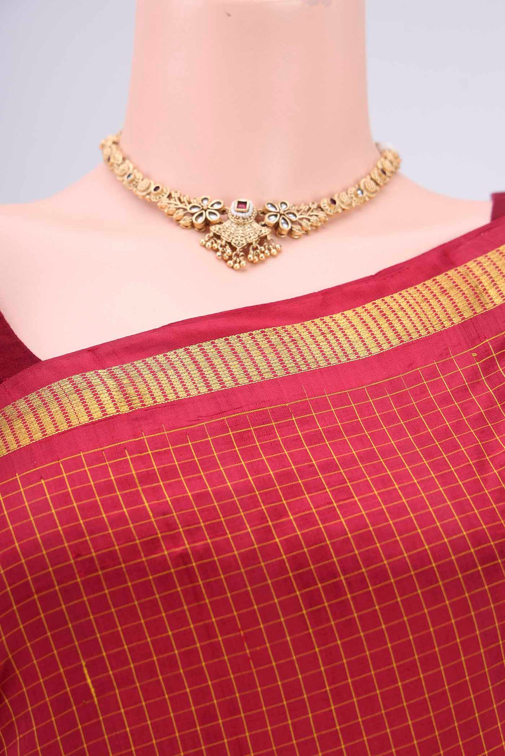 Border image of Maroon Dual Tone Kanchipuram Silk Saree with Checked design on the body and Zari Border. 