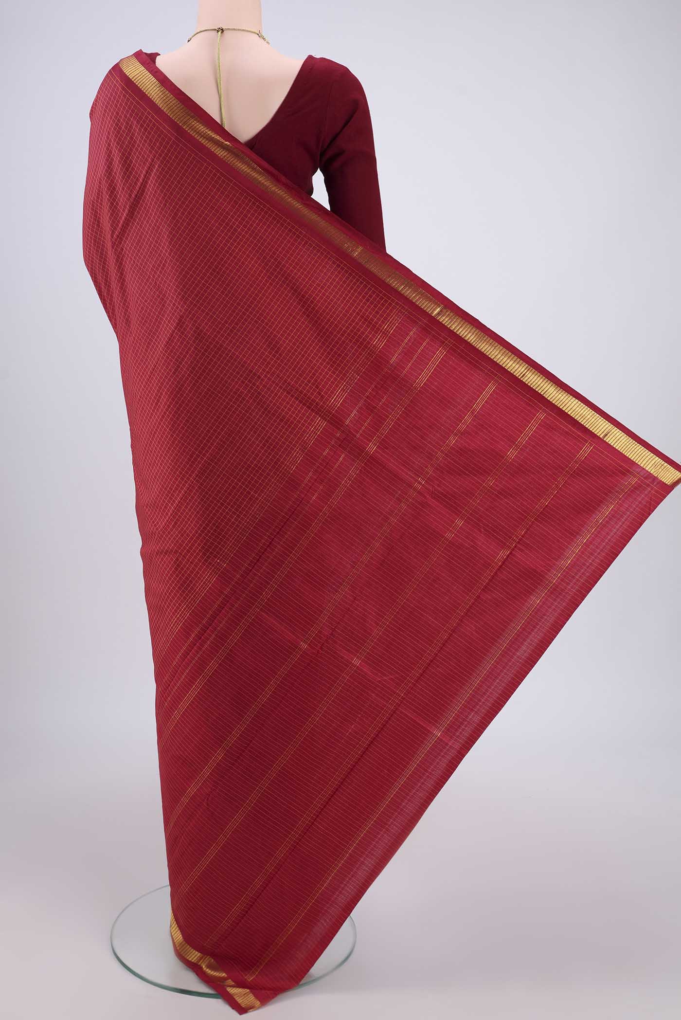 Flat view of Maroon Dual Tone Kanchipuram Silk Saree with Checked design on the body and Zari Border. 