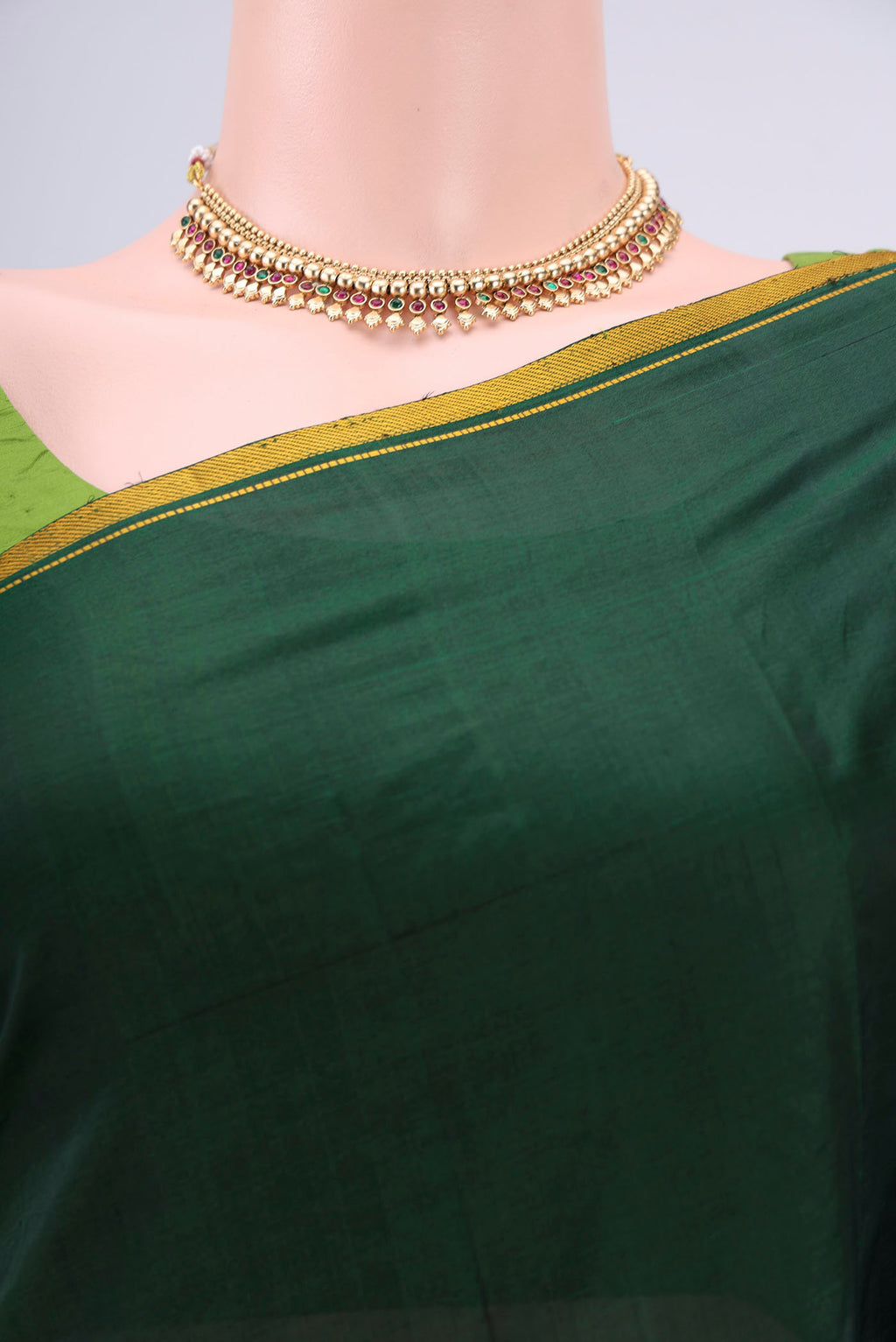 Border image of Bottle Green Dual Tone Kanchipuram Silk Saree with Plain Body and Zari And Thread Border. 