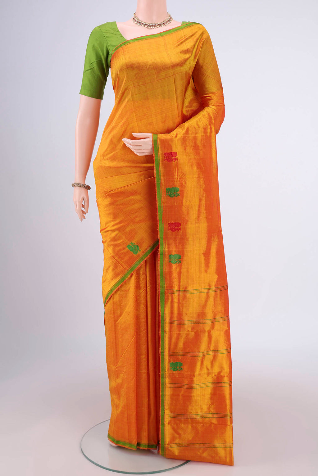 Yellow Dual Tone Kanchipuram Silk Saree with Checked design on the body and Thread Border.  displayed on a mannequin
