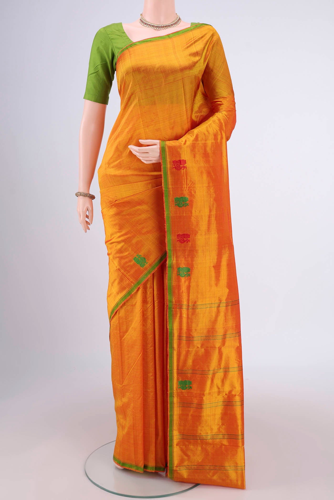 Yellow Dual Tone Kanchipuram Silk Saree with Checked design on the body and Thread Border.  displayed on a mannequin