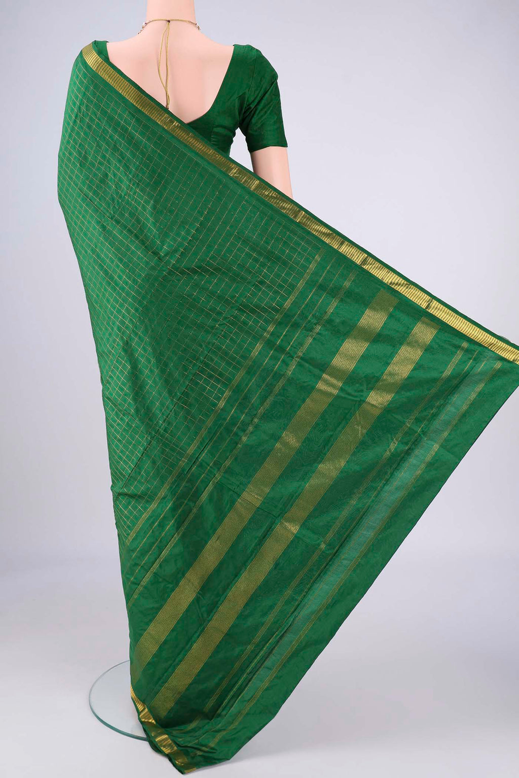 Flat view of Bottle Green Kanjivaram Silk Saree with Checked design on the body and Zari Border. 