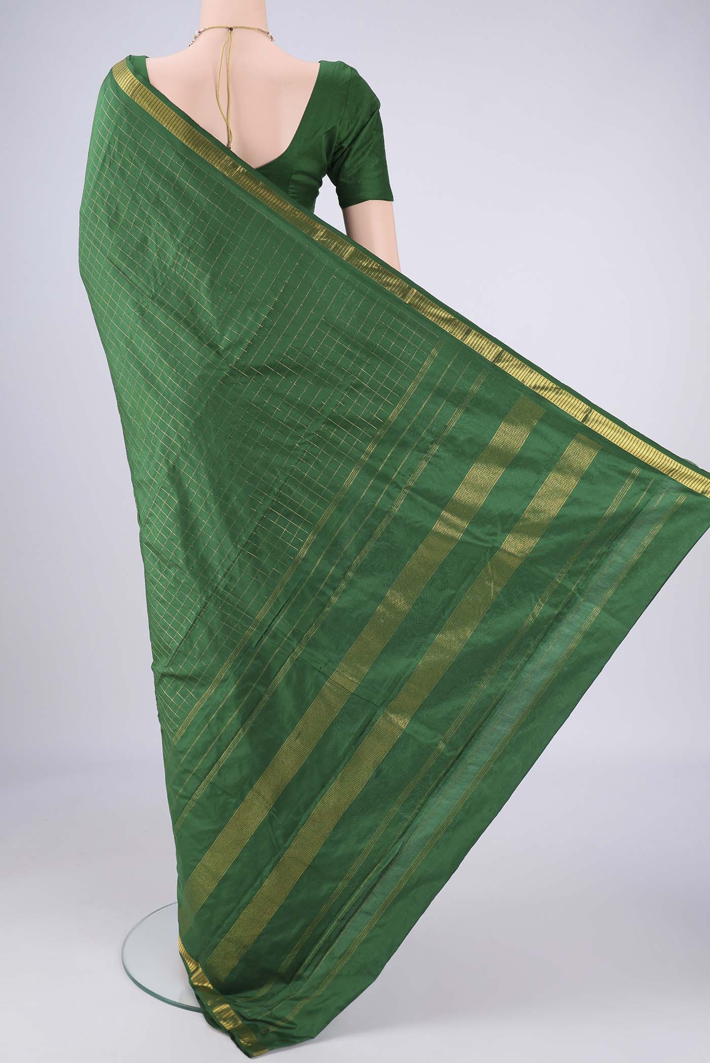 Flat view of Bottle Green Kanjivaram Silk Saree with Checked design on the body and Zari Border. 