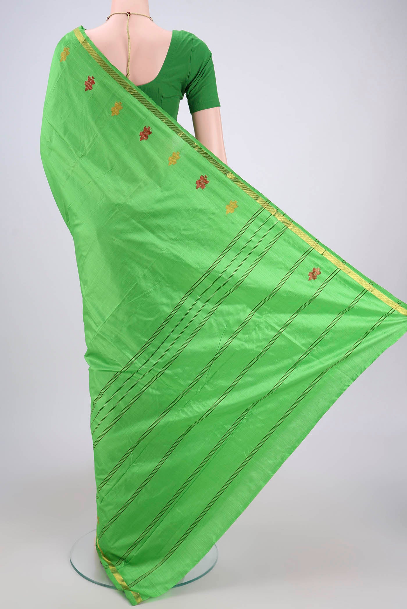 Flat view of Parrot Green Kanchipuram Silk Saree with Plain Body and Zari And Thread Border. 