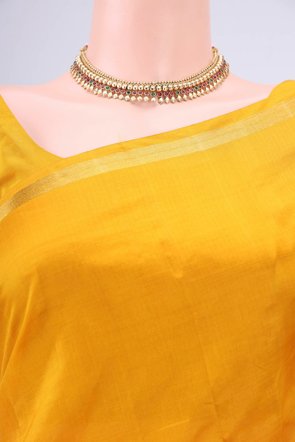 Border image of Mustard Kanchipuram Silk Saree with Plain Body and Zari And Thread Border. 