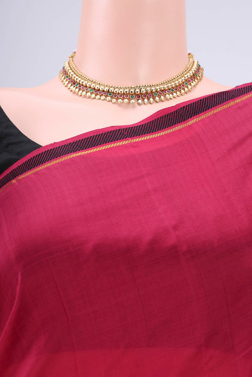 Border image of Maroon Kanchipuram Silk Saree with Plain Body and Zari And Thread Border. 