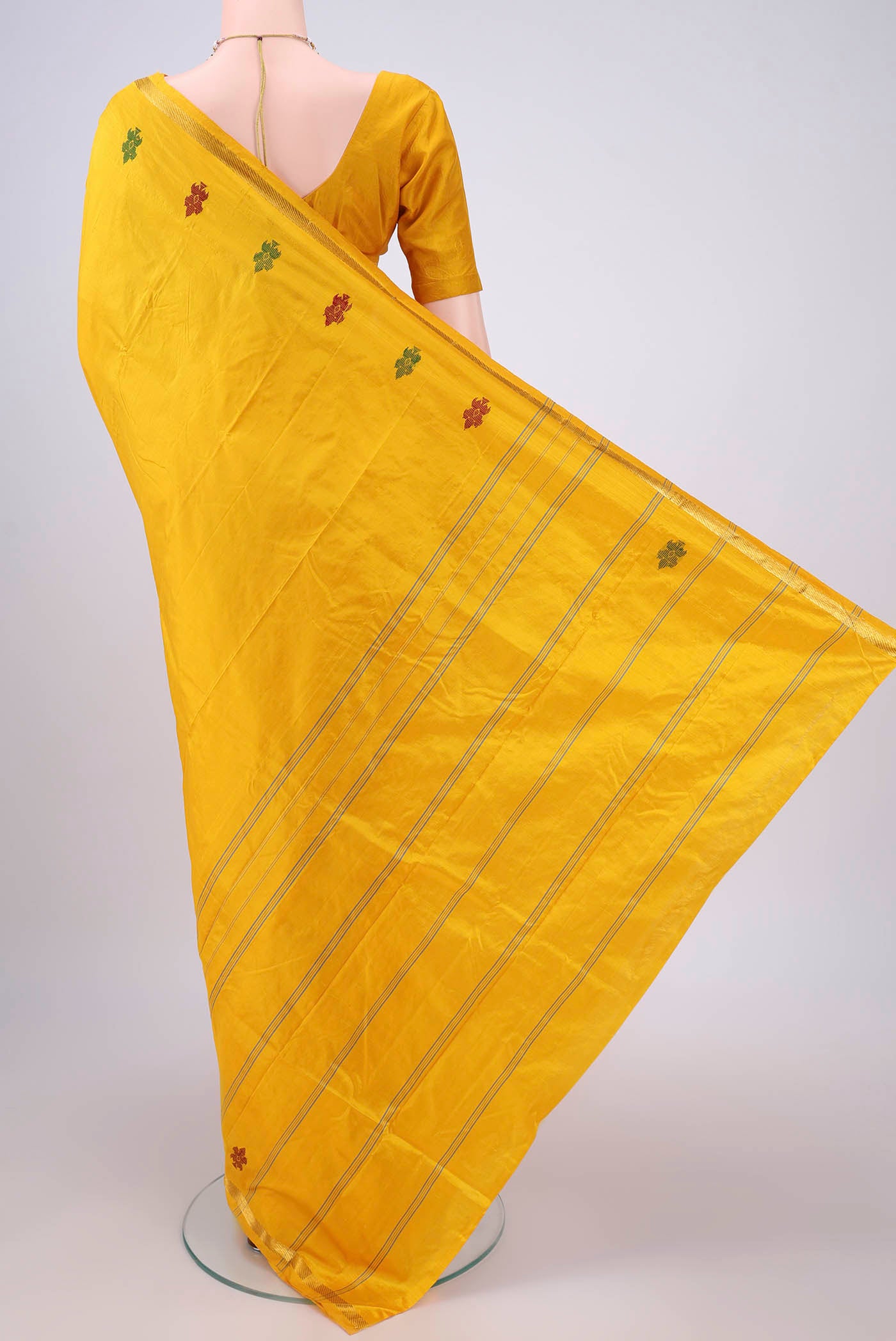 Flat view of Yellow Kanchipuram Silk Saree with Plain Body and Zari And Thread Border. 