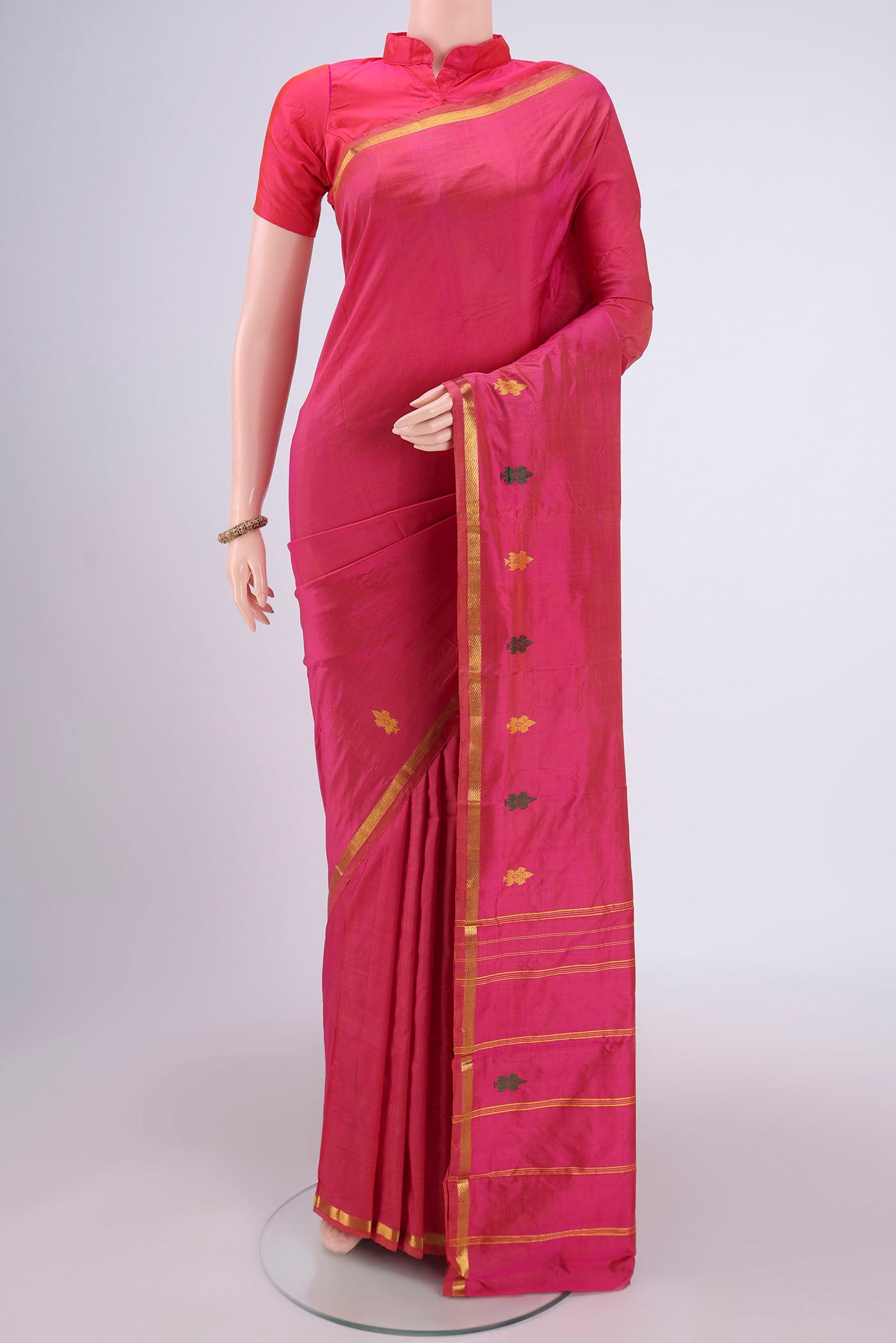 Pink Kanchipuram Silk Saree with Plain Body and Zari Border.  displayed on a mannequin