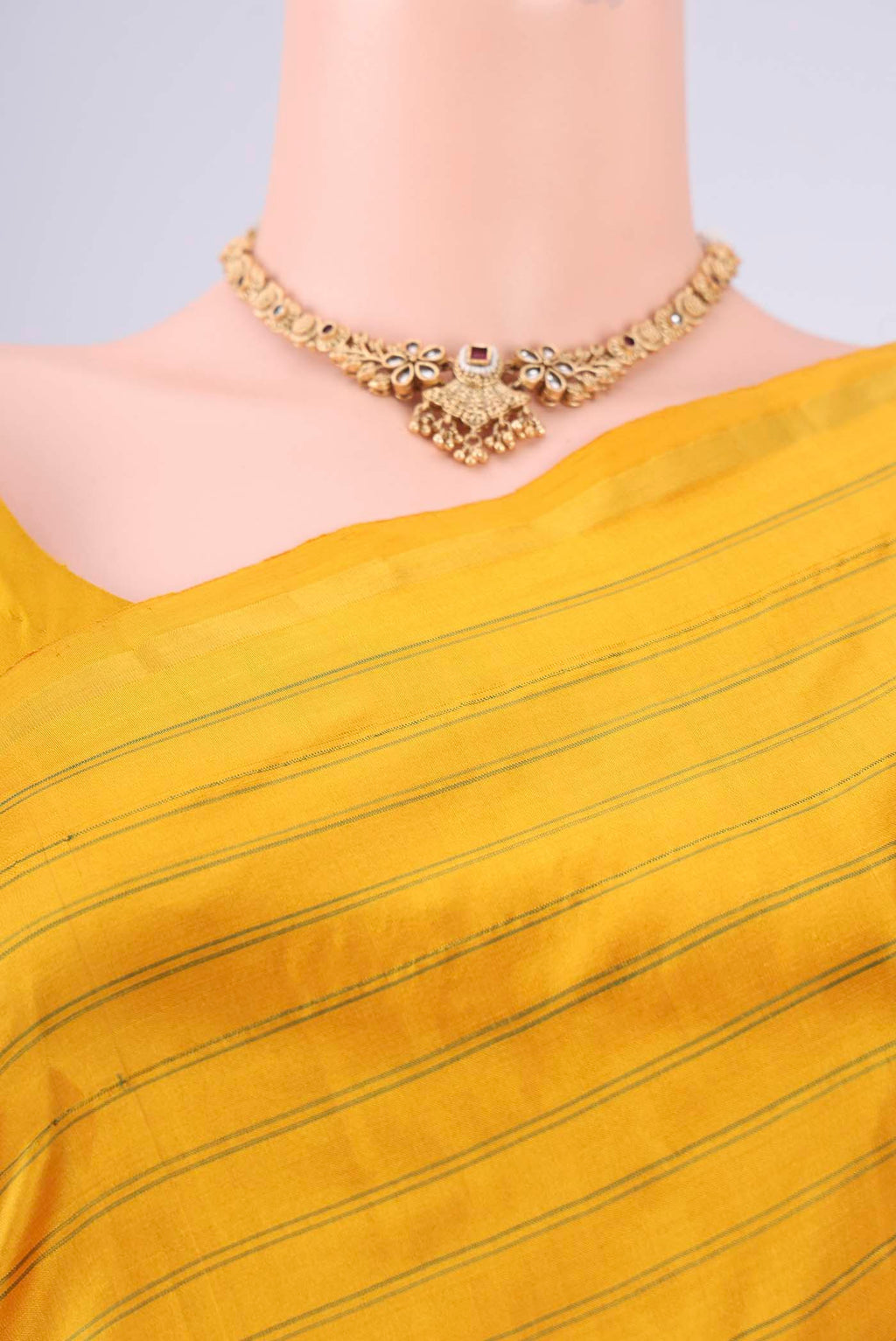 Border image of Mustard Dual Tone Kanchipuram Silk Saree with Stripes on the body and Zari Border. 