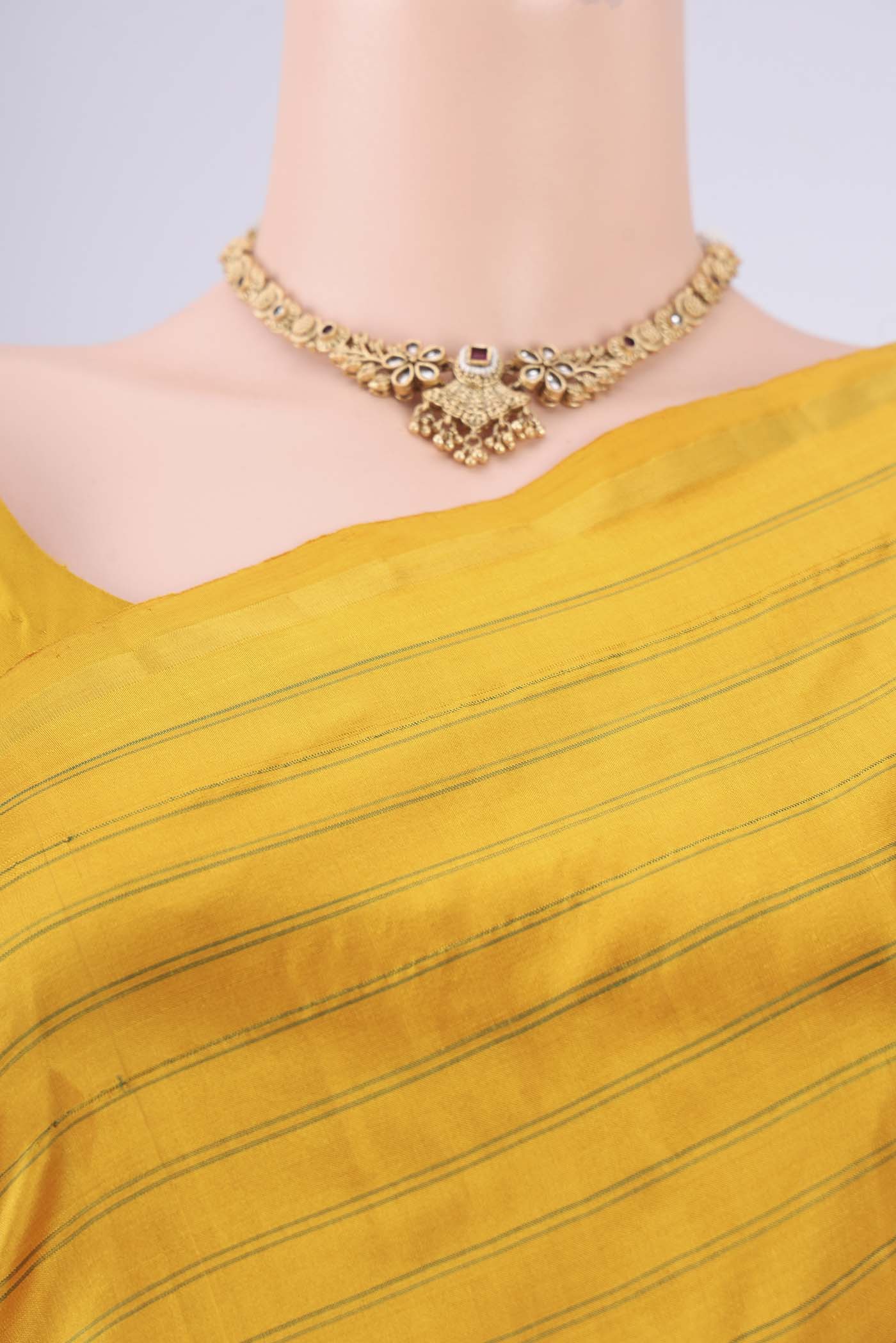 Border image of Mustard Dual Tone Kanchipuram Silk Saree with Stripes on the body and Zari Border. 