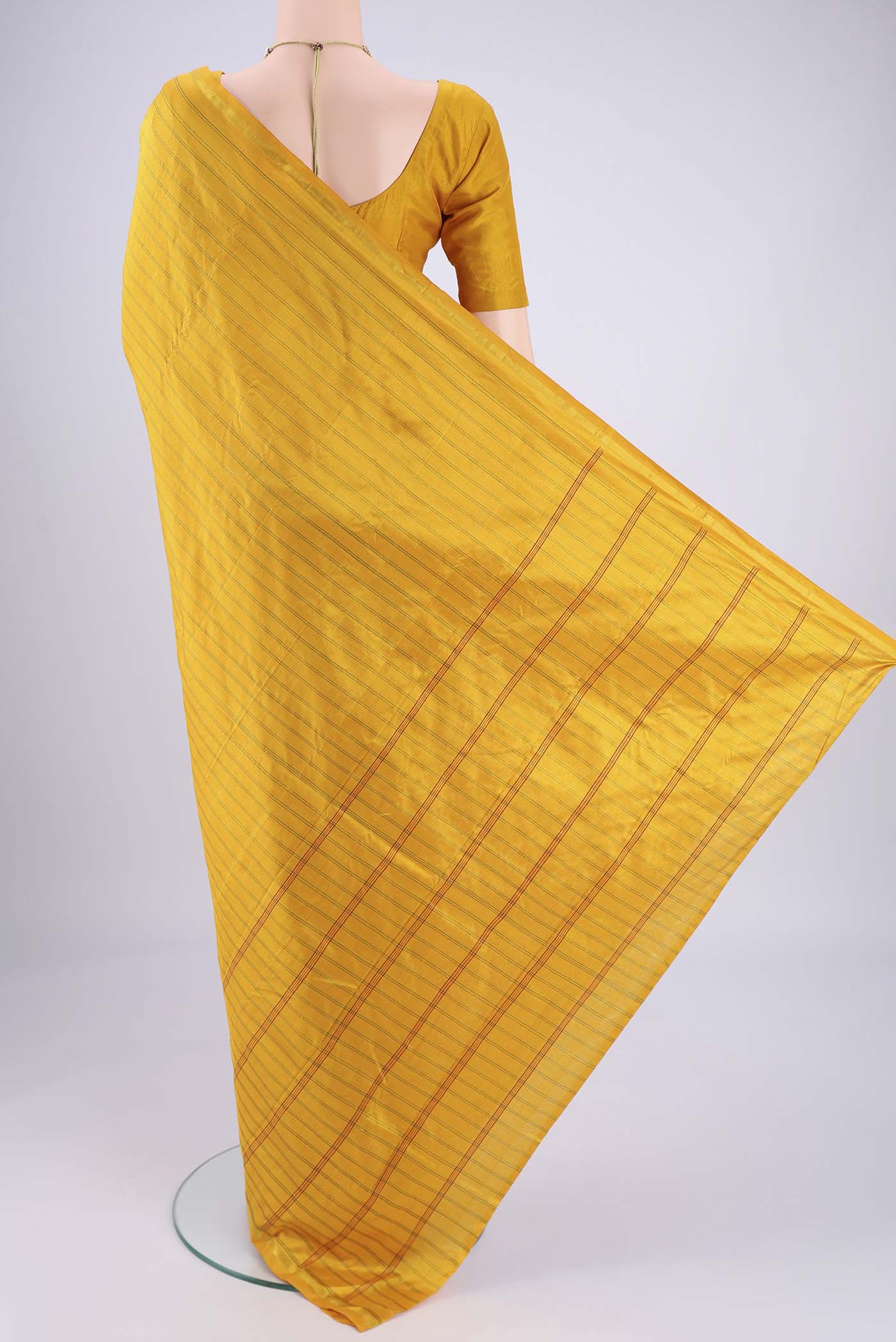 Flat view of Mustard Dual Tone Kanchipuram Silk Saree with Stripes on the body and Zari Border. 
