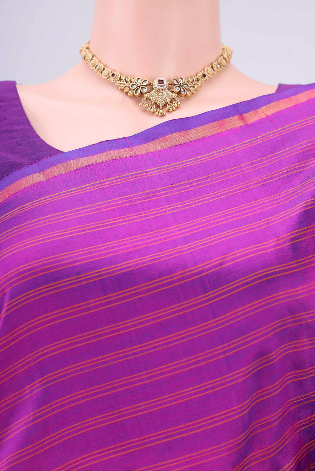 Border image of Magenta Kanchipuram Silk Saree with Stripes on the body and Zari Border. 