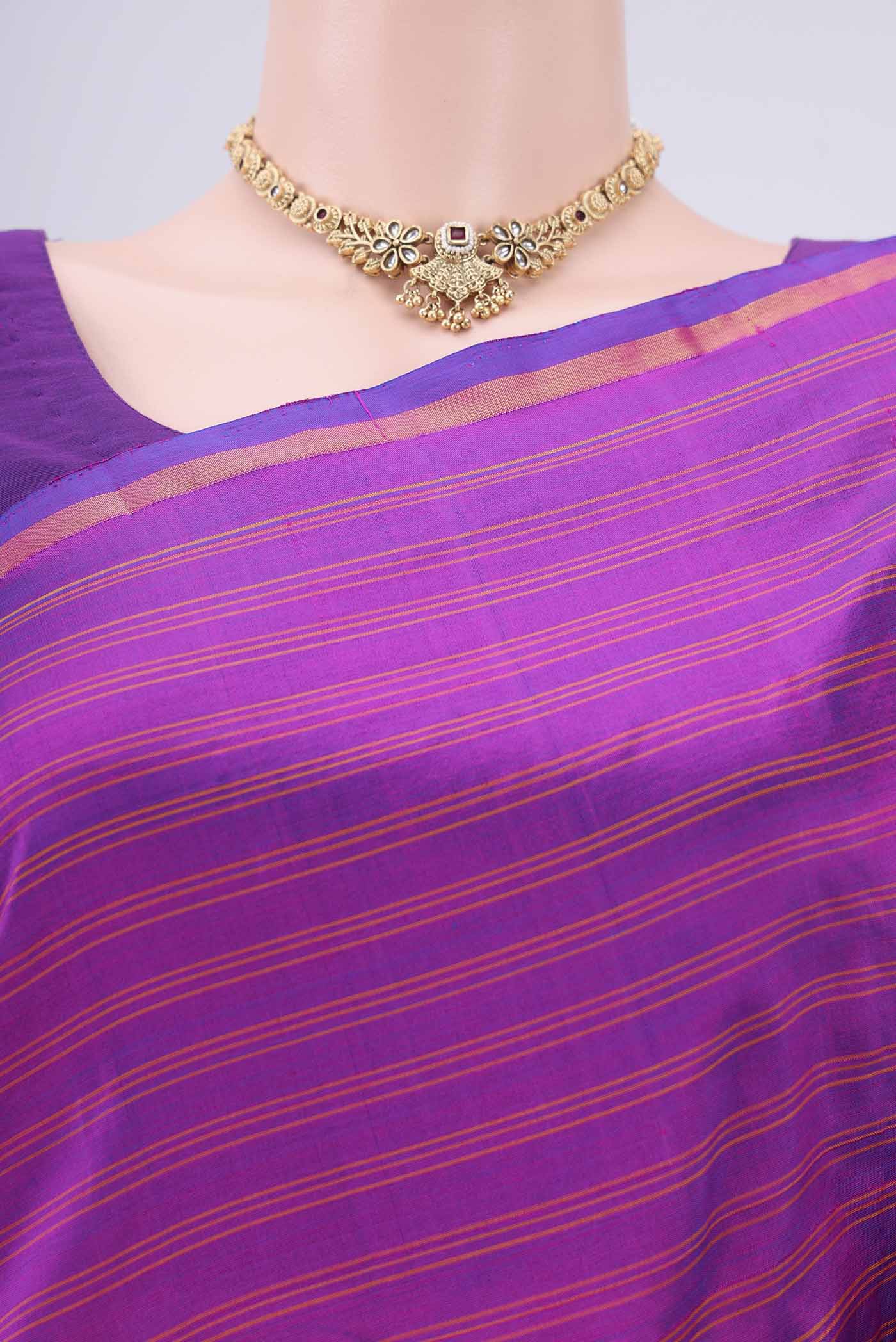 Border image of Magenta Kanchipuram Silk Saree with Stripes on the body and Zari Border. 
