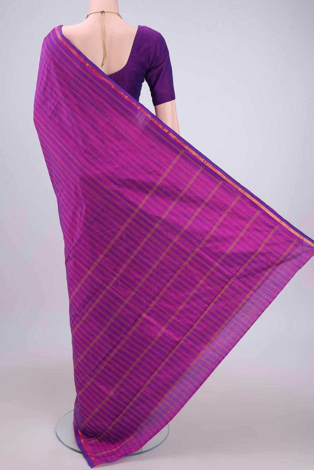 Flat view of Magenta Kanchipuram Silk Saree with Stripes on the body and Zari Border. 