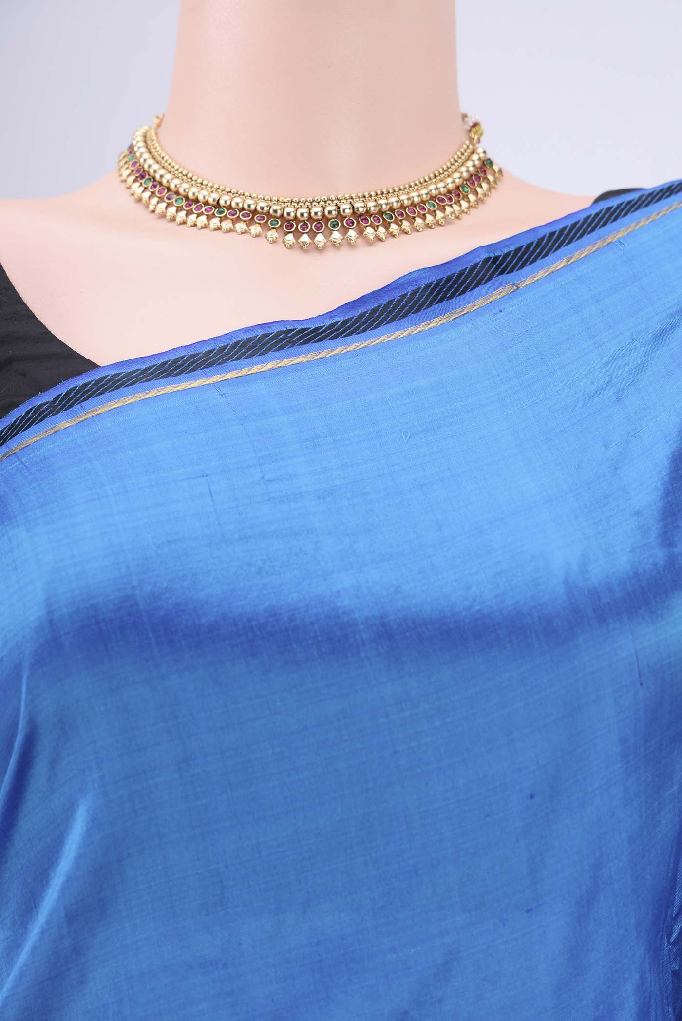 Border image of Blue Kanchipuram Silk Saree with Plain Body and Zari Border. 