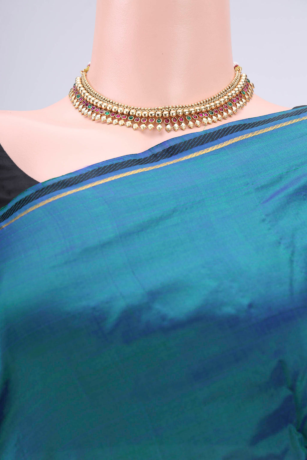 Border image of Peacock Blue Kanchipuram Silk Saree with Plain Body and Zari And Thread Border. 