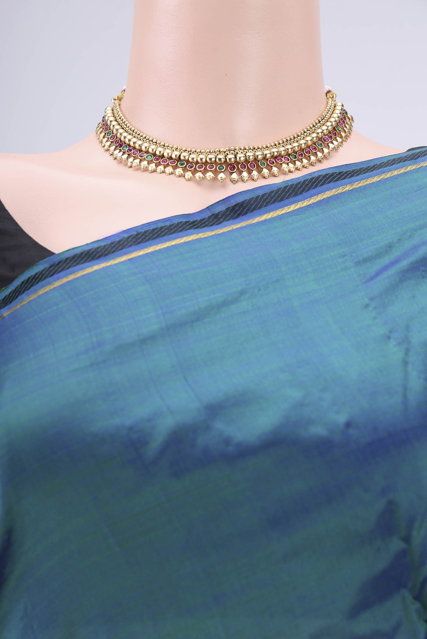Border image of Peacock Blue Kanchipuram Silk Saree with Plain Body and Zari And Thread Border. 