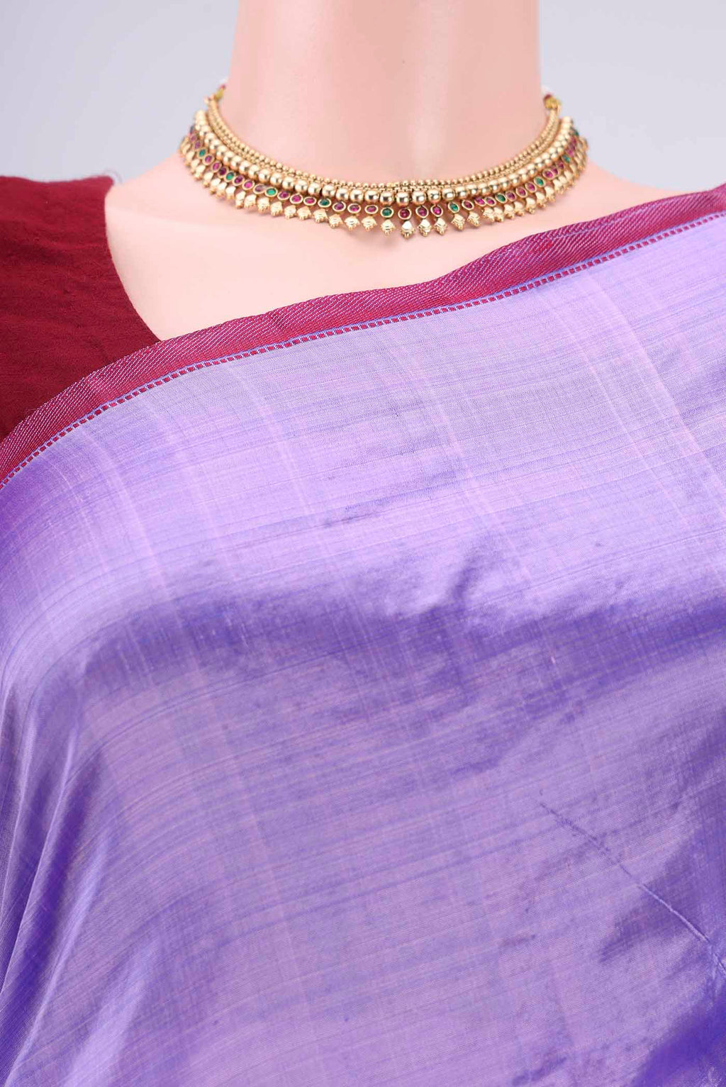 Border image of Violet Kanchipuram Silk Saree with Plain Body and Zari And Thread Border. 