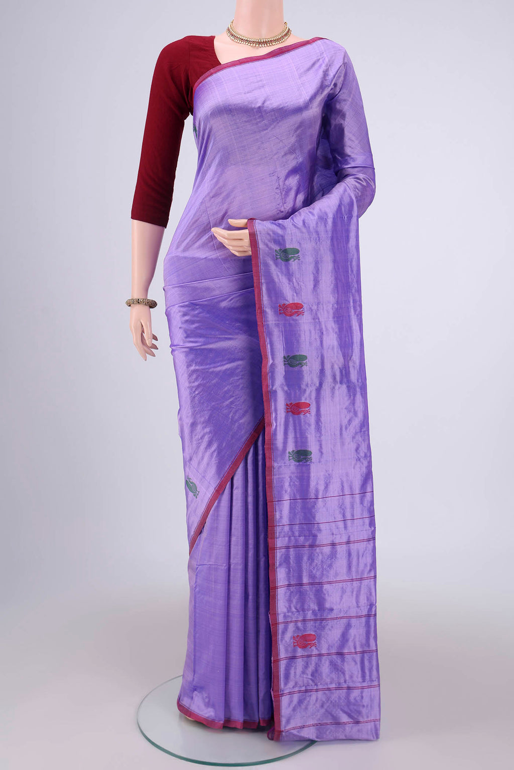 Violet Kanchipuram Silk Saree with Plain Body and Zari And Thread Border.  displayed on a mannequin