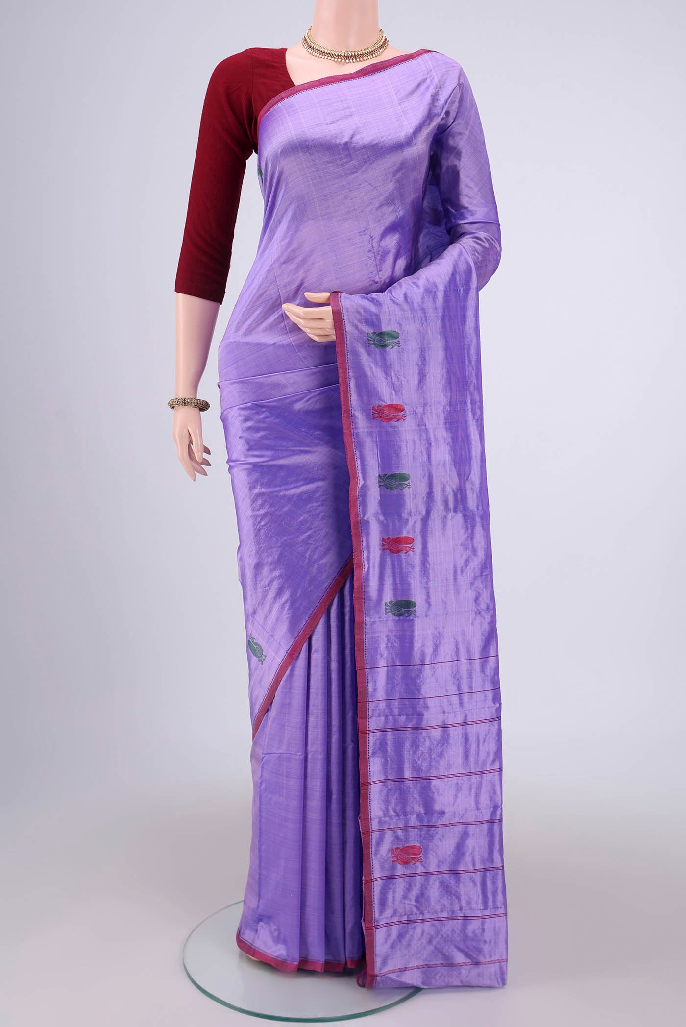 Violet Kanchipuram Silk Saree with Plain Body and Zari And Thread Border.  displayed on a mannequin