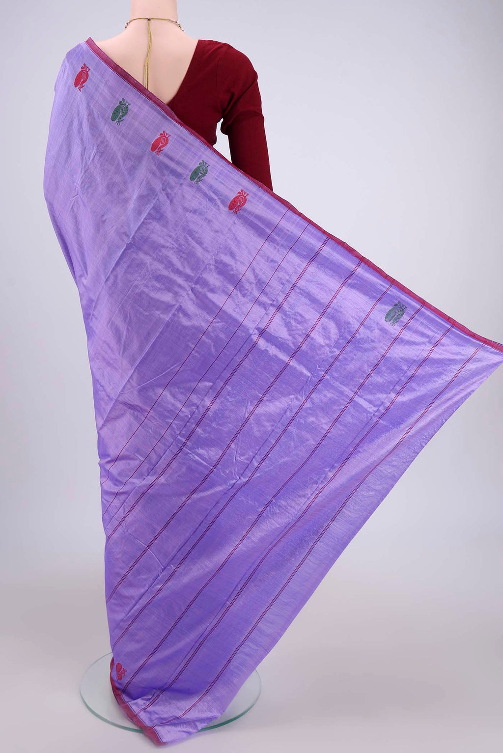 Flat view of Violet Kanchipuram Silk Saree with Plain Body and Zari And Thread Border. 