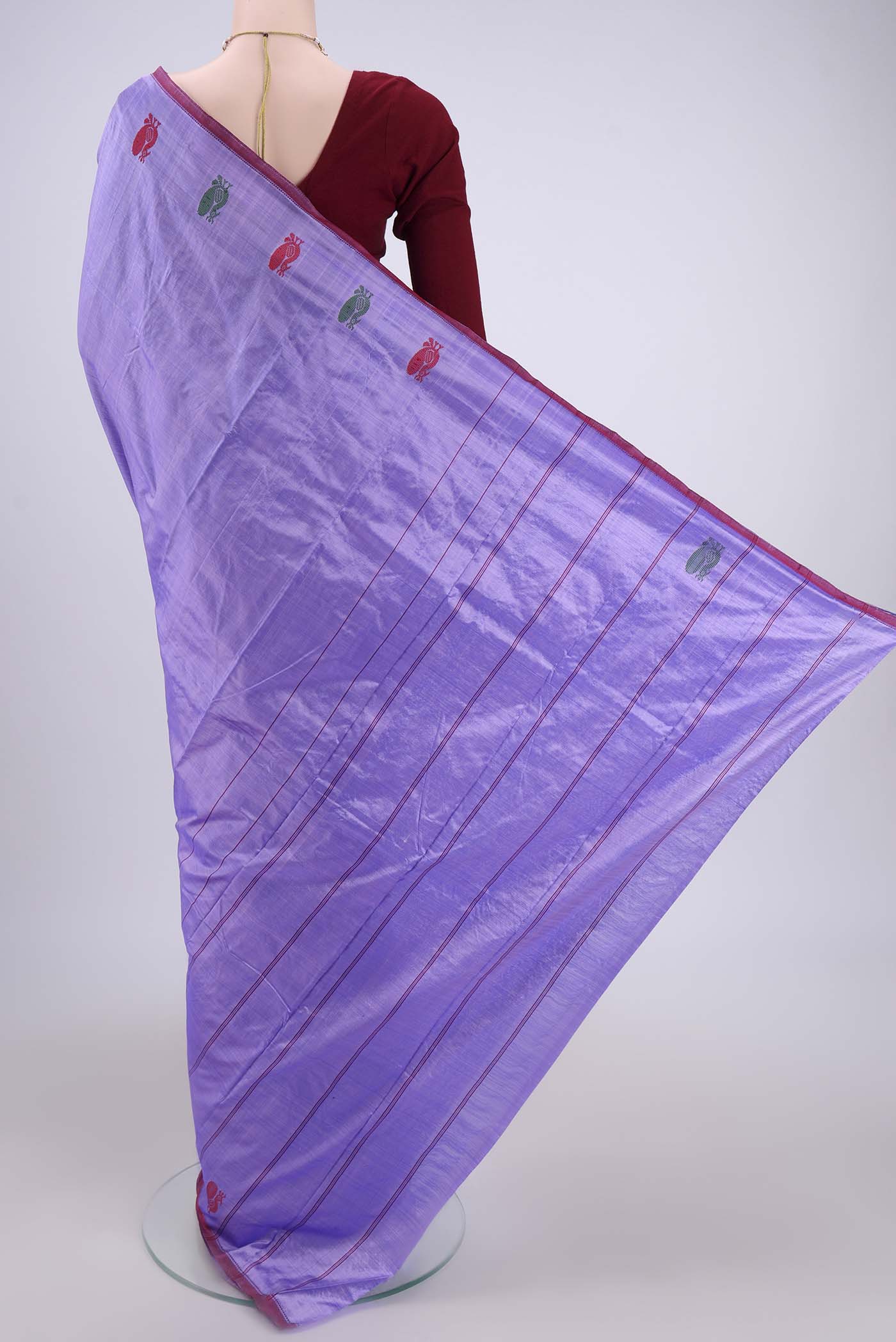 Flat view of Violet Kanchipuram Silk Saree with Plain Body and Zari And Thread Border. 