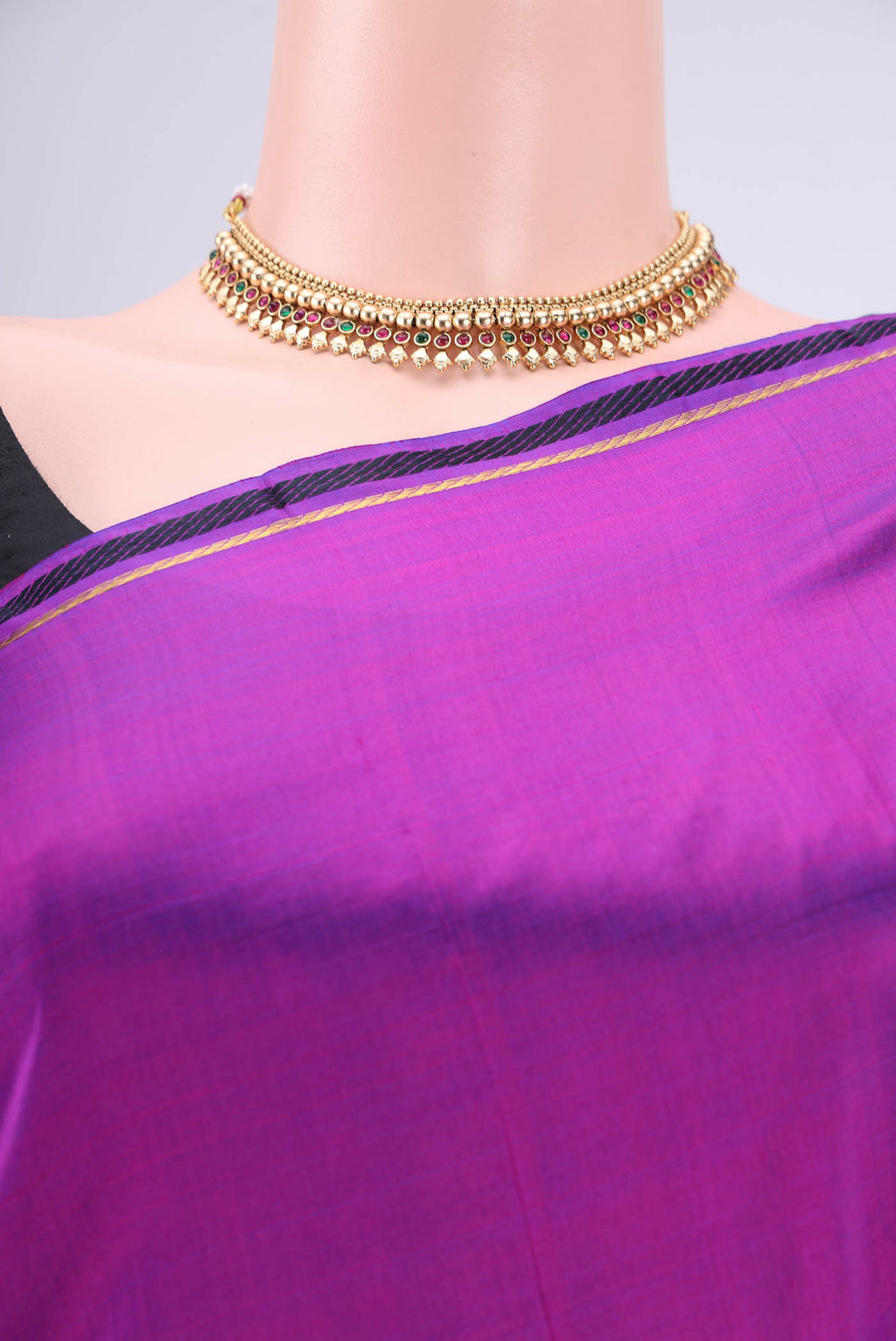 Border image of Purple Dual Tone Kanchipuram Silk Saree with Plain Body and Zari And Thread Border. 