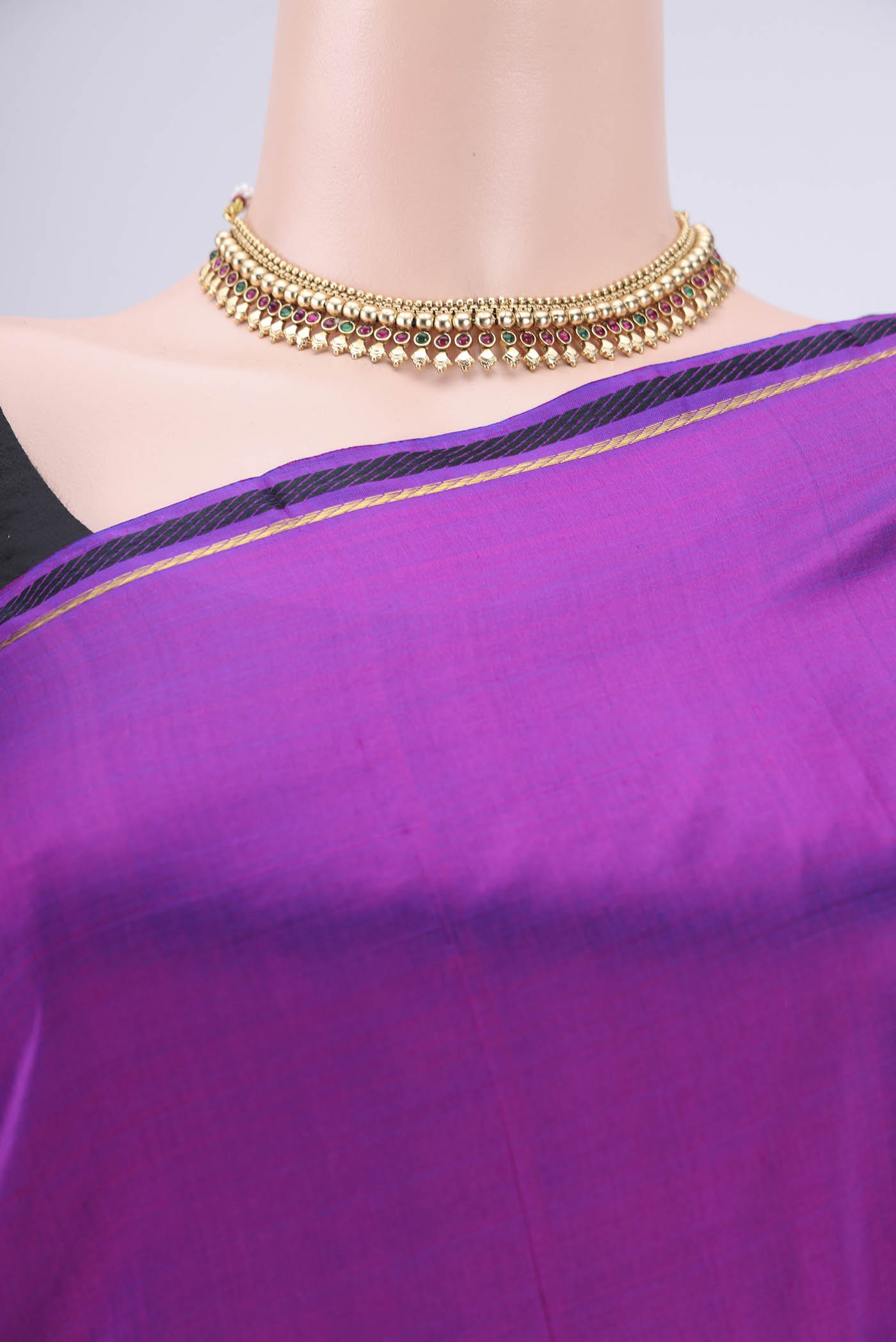 Border image of Purple Dual Tone Kanchipuram Silk Saree with Plain Body and Zari And Thread Border. 